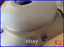 NOS 11341-01A10 TS125X 1986 to 1988 Genuine Suzuki Black Clutch Cover with marks
