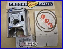 NOS 12110-41791 & 12140-41791 RM370 +. 75mm Genuine Suzuki Piston & Ring Set