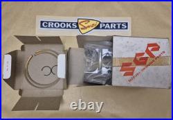 NOS 12110-41791 & 12140-41791 RM370 +. 75mm Genuine Suzuki Piston & Ring Set