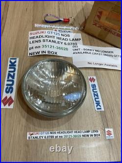 SUZUKI GT125 NOS HEADLIGHT HEAD LAMP LENS STANLEY 6.0789 pt no 35121-36020 NEW