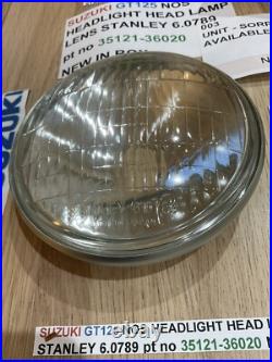SUZUKI GT125 NOS HEADLIGHT HEAD LAMP LENS STANLEY 6.0789 pt no 35121-36020 NEW