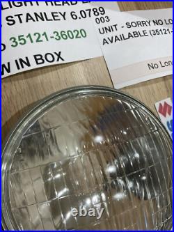 SUZUKI GT125 NOS HEADLIGHT HEAD LAMP LENS STANLEY 6.0789 pt no 35121-36020 NEW