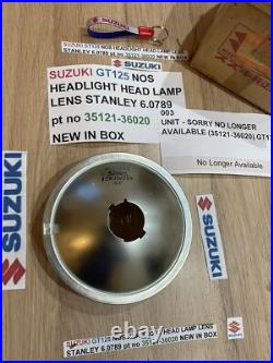 SUZUKI GT125 NOS HEADLIGHT HEAD LAMP LENS STANLEY 6.0789 pt no 35121-36020 NEW