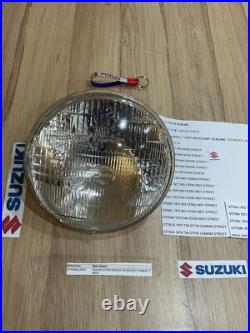 SUZUKI GT125 NOS HEADLIGHT HEAD LAMP LENS STANLEY 6.0789 pt no 35121-36020 NEW