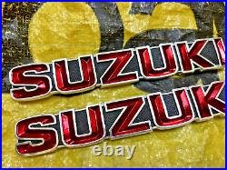 Suzuki GT185 GT250 GT380 GT550 T350 Tank Badges Emblem NOS Genuine 68111-33000 Suzuki GT185 GT250 GT380 GT550 T350 Tank Badges Emblem NOS Genuine 68111-33000