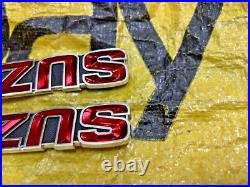 Suzuki GT185 GT250 GT380 GT550 T350 Tank Badges Emblem NOS Genuine 68111-33000 Suzuki GT185 GT250 GT380 GT550 T350 Tank Badges Emblem NOS Genuine 68111-33000