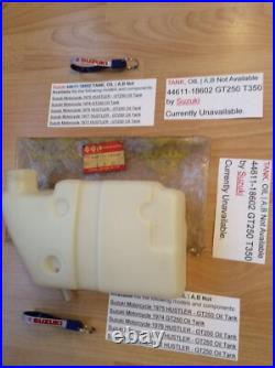 Suzuki GT250 T350 NOS OIL TANK WITH SUZUKI BAG + PARTS TAG PT NO 44611-18602