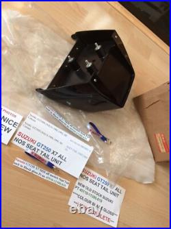 Suzuki GT250 X7 NOS all models Seat Tail unit in Black Gloss pt 45510-11300-019 Suzuki GT250 X7 NOS all models Seat Tail unit in Black Gloss pt 45510-11300-019