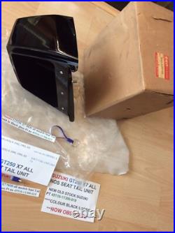 Suzuki GT250 X7 NOS all models Seat Tail unit in Black Gloss pt 45510-11300-019 Suzuki GT250 X7 NOS all models Seat Tail unit in Black Gloss pt 45510-11300-019