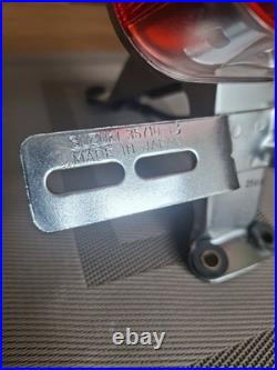 Vintage Suzuki T250 TS 50 100 125 185 250 400 Rear Lamp and Bracket. NOS OEM